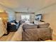 Relax in this living room with modern furnishings, a ceiling fan, and sliders to the outdoors at 2100 N Peninsula Ave # 2160, New Smyrna Beach, FL 32169
