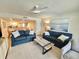 Cozy living room featuring modern decor, a ceiling fan, and an open floor plan for seamless entertaining at 2100 N Peninsula Ave # 2160, New Smyrna Beach, FL 32169