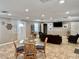 Open-concept living space with dining area, comfortable seating, and bright lighting, perfect for entertaining at 2100 N Peninsula Ave # 2160, New Smyrna Beach, FL 32169