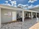 Comfortable covered patio area with seating, ceiling fans, and posted pool rules for residents and guests at 2100 N Peninsula Ave # 2160, New Smyrna Beach, FL 32169