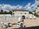 Community pool area with well-maintained patio, comfortable seating, and a BBQ grill for outdoor enjoyment at 2100 N Peninsula Ave # 2160, New Smyrna Beach, FL 32169