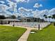 Inviting outdoor pool area with lush green lawn and condo buildings at 2100 N Peninsula Ave # 2160, New Smyrna Beach, FL 32169