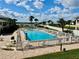 Sparkling community pool with views of the water, and palm trees for the ultimate Florida lifestyle at 2100 N Peninsula Ave # 2160, New Smyrna Beach, FL 32169