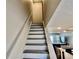Stairway leading up to the living space, showcasing the home's design at 2100 N Peninsula Ave # 2160, New Smyrna Beach, FL 32169