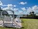 Relaxing waterfront swing set and lounge area with a peaceful view of the marina and the water at 2100 N Peninsula Ave # 2160, New Smyrna Beach, FL 32169