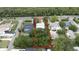 Aerial view of a property with clearly defined lot lines, highlighting its placement within a lush, green neighborhood at 2107 Saxon Dr, New Smyrna Beach, FL 32169