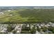 This aerial view highlights property in relation to nearby marshland and residential community at 2107 Saxon Dr, New Smyrna Beach, FL 32169