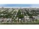 A high aerial view shows neighborhood, with proximity to the beach and waterfront at 2107 Saxon Dr, New Smyrna Beach, FL 32169