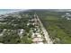 This aerial view shows property in relation to the nearby coastline and waterfront at 2107 Saxon Dr, New Smyrna Beach, FL 32169
