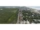 An aerial view shows the property and surrounding neighborhood, conveniently located near the beach at 2107 Saxon Dr, New Smyrna Beach, FL 32169