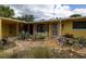 Charming single-story home featuring a landscaped front yard with unique desert plants at 2107 Saxon Dr, New Smyrna Beach, FL 32169