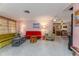 Open living space with eclectic decor, showcasing seamless transition to the kitchen and dining area at 2107 Saxon Dr, New Smyrna Beach, FL 32169