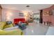 A vibrant living room is showcased with eclectic furniture and decor, creating a welcoming and unique atmosphere at 2107 Saxon Dr, New Smyrna Beach, FL 32169