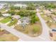Aerial view of the home showcasing its location on a corner lot and beautiful landscaping at 2435 Alton Rd, Deltona, FL 32738