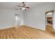 Bedroom featuring wood floors, white walls, and a ceiling fan at 2435 Alton Rd, Deltona, FL 32738