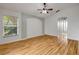 Bright bedroom with wood floors and a connecting archway to the bathroom at 2435 Alton Rd, Deltona, FL 32738