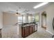 Bright kitchen featuring tile flooring, a double sink, and an eat-in bar area at 2435 Alton Rd, Deltona, FL 32738