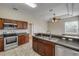 Traditional-style kitchen with stainless steel appliances and a double sink at 2435 Alton Rd, Deltona, FL 32738