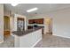 Modern kitchen with stainless steel appliances, dark wood cabinets, and a breakfast bar at 2435 Alton Rd, Deltona, FL 32738