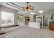 Spacious living room with tile flooring, a ceiling fan, and lots of natural light at 2435 Alton Rd, Deltona, FL 32738