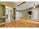 Open-concept living area with a fireplace and a seamless flow to the adjacent kitchen at 2435 Alton Rd, Deltona, FL 32738
