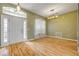 Spacious living room with hardwood floors, natural light, and neutral paint at 2435 Alton Rd, Deltona, FL 32738