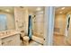 Bright bathroom featuring a shower and tub combination with white cabinets and tile flooring at 250 Minorca Beach Way # 206, New Smyrna Beach, FL 32169