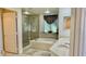 Bright bathroom with a large tub and glass enclosed shower at 250 Minorca Beach Way # 206, New Smyrna Beach, FL 32169