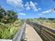 Beautiful community boardwalk through the scenic landscape at 250 Minorca Beach Way # 206, New Smyrna Beach, FL 32169
