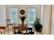 Inviting breakfast nook with great natural light, and comfortable seating by the outdoor deck at 250 Minorca Beach Way # 206, New Smyrna Beach, FL 32169
