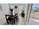 Breakfast nook with comfortable seating and an open slider that provides access to the outdoor deck at 250 Minorca Beach Way # 206, New Smyrna Beach, FL 32169