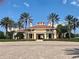 Exterior of the community clubhouse showcases the mediterranean architecture at 250 Minorca Beach Way # 206, New Smyrna Beach, FL 32169