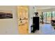 Bright kitchen featuring white cabinetry and granite countertops at 250 Minorca Beach Way # 206, New Smyrna Beach, FL 32169