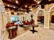 Luxurious lounge area with stylish furnishings, beautiful flooring, and intricate ceiling details, creating a sophisticated ambiance at 250 Minorca Beach Way # 206, New Smyrna Beach, FL 32169