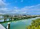 Picturesque marina view with boats docked in the calm, clear water and a bright sky overhead at 250 Minorca Beach Way # 206, New Smyrna Beach, FL 32169