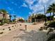 Beautiful resort-style pool surrounded by palm trees, lounge seating, and community buildings at 250 Minorca Beach Way # 206, New Smyrna Beach, FL 32169