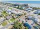Picturesque aerial view showcasing homes nestled near the coast, with a beautiful beach just a short distance away at 2510 S Atlantic Ave, New Smyrna Beach, FL 32169