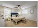 Comfortable bedroom with floral wallpaper, plush bedding, and ample natural light at 2510 S Atlantic Ave, New Smyrna Beach, FL 32169