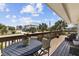 Inviting outdoor deck with dining table and chairs, offering a perfect spot for al fresco meals and relaxation at 2510 S Atlantic Ave, New Smyrna Beach, FL 32169