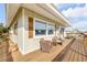 Expansive wooden deck with seating, perfect for outdoor relaxation and enjoying the scenic views at 2510 S Atlantic Ave, New Smyrna Beach, FL 32169