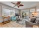 Cozy living room with a slider door to the backyard pool and patio area at 2510 S Atlantic Ave, New Smyrna Beach, FL 32169