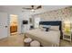 Serene main bedroom with floral wallpaper, plush bedding, and ample natural light at 2510 S Atlantic Ave, New Smyrna Beach, FL 32169
