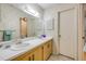 Bathroom featuring double sinks and ample counter space in a cozy setting at 257 Club House Blvd, New Smyrna Beach, FL 32168