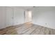 Spacious bedroom featuring a wide plank floor and neutral color walls at 257 Club House Blvd, New Smyrna Beach, FL 32168