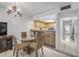 Dining area with view into kitchen and stairway access at 257 Club House Blvd, New Smyrna Beach, FL 32168