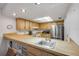 Bright kitchen with stainless steel appliances and breakfast bar at 257 Club House Blvd, New Smyrna Beach, FL 32168