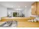 The kitchen overlooks the living room for easy entertaining at 257 Club House Blvd, New Smyrna Beach, FL 32168