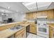 Well-lit kitchen with lots of counter space, opening to living area at 257 Club House Blvd, New Smyrna Beach, FL 32168