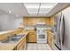 Bright kitchen with stainless steel appliances and ample counter space at 257 Club House Blvd, New Smyrna Beach, FL 32168