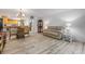 Open-concept living room with dining area and access to the kitchen at 257 Club House Blvd, New Smyrna Beach, FL 32168